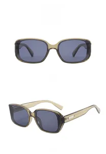 Detail view of vintage dark green square frames and gray lenses with metal accents
