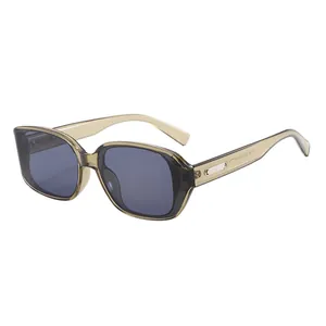Retro oversized square sunglasses with transparent tea frame and dark grey lenses