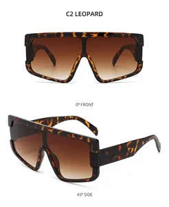 Makroansicht der quadratischen Übergroße-Sonnenbrille mit Leopardenmuster und braunem Glas