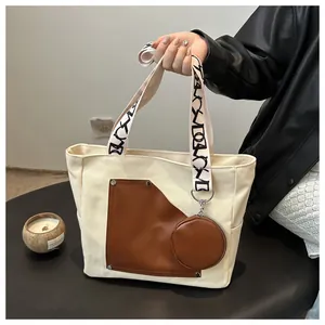 Large capacity canvas tote bag with brown leather patch and patterned shoulder strap
