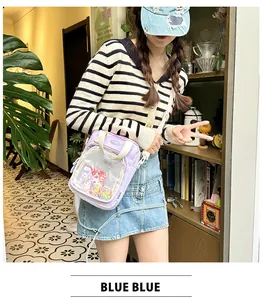 Detailed view of the cute purple canvas crossbody bag with clear front mesh pocket for women.