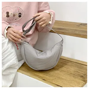 Casual grey crescent shoulder bag detail view, versatile dumpling crossbody bag for women daily.