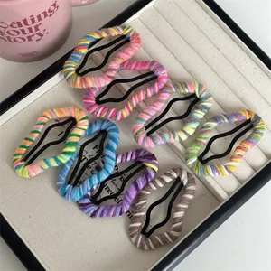 Set of 7 colorful plush knit cloud hair clips for women in a stylish jewelry display tray