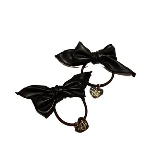 Chic black PU leather bow hair ties with gold heart charms and high elasticity