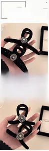 Detail of black flocked shark clip with luxury heart rhinestones and silver crystal accents