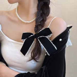 Lace bow hair clip with velvet fabric and white pearl necklace accessory for women