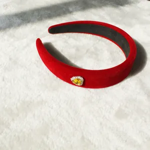 Red velvet padded headband with heart-shaped yellow rhinestone and silver diamond inlay