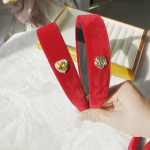 Red velvet padded headbands with heart crystal and gold flower embellishments