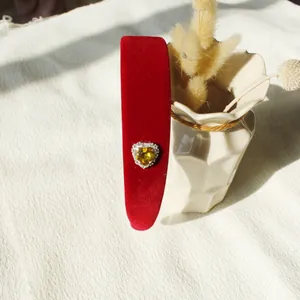 Elegant red velvet wide headband with a sparkling rhinestone heart gem centerpiece