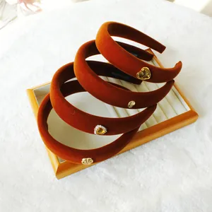 Brown velvet headbands with vintage gold charms and crystals in a stackable set