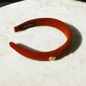 Caramel velvet padded headband with golden metallic rose detail and handmade label