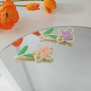 Morandi macaron floral hair clips with pearls and green leaves on a mirror base