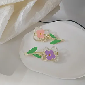 Cute Morandi macaron flower hair clips with pearls and green leaves on white tray