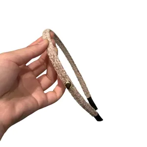Chic beige plush headband with gold button detail, boosting hair volume styling