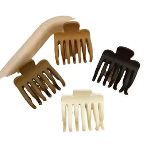 Set of four matte hair claw clips in brown, coffee, black, and beige for half-up hair