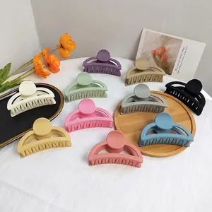 Matte finish large hair claws in 10 Morandi colors set on a stylish background display