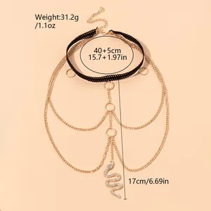 Bohemian gouden beenketting met slangenhanger, strass kwastjes en zwart kantwerk