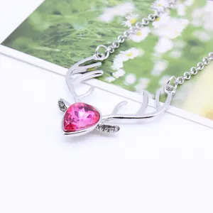 Silver deer antler necklace with heart-shaped pink gemstone and white cubic zirconia