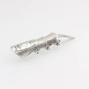 Detailed view of silver gothic armor ring with jointed metal segments and sharp claw tip