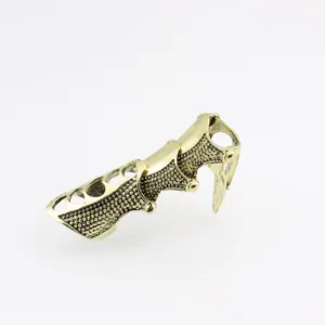 Gothic punk joint armor ring in antique gold finish with intricate hollow-out metal texture