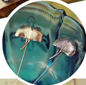 Elegant ginkgo leaf lapel pins in gold and silver finish with detailed leaf veins