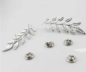 Silver leaf-shaped stud earrings with realistic plant texture and metal backings