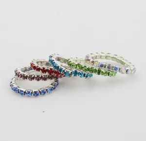 Macro shot of colorful rhinestone toe rings set with elastic bands and silver alloy bases