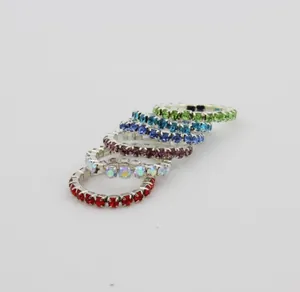 Macro detail of rhinestone stretch toe rings in six vibrant colors with silver base
