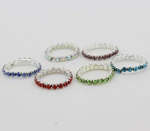 Detail of multi-color rhinestone elastic toe rings with silver-tone claw chain base