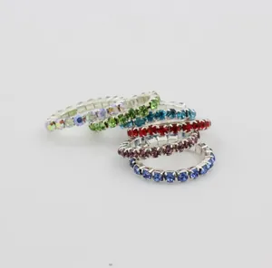 Close-up of elastic rhinestone toe rings featuring colorful crystal claw chains