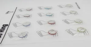 Close-up of 12-piece crystal invisible toe ring set in various vibrant colors