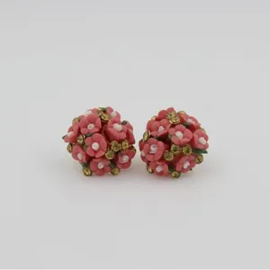 Stereoscopic floral stud earrings with pink ceramic flowers and sparkling rhinestones