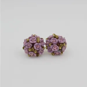 Fashionable purple and pink ceramic flower stud earrings with golden rhinestones