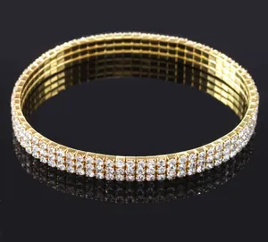 Bracelet de cheville extensible à trois rangées de strass dorés avec reflet brillant