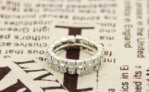 Detailed close-up of double-row silver elastic ring with sparkling crystal rhinestones