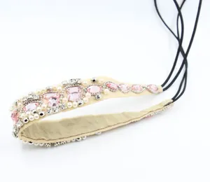 Detail of handmade beaded headband with pink crystals, white pearls and elastic band