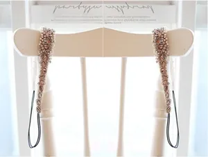 Detailed close-up of handmade pearl and crystal beaded headband with vintage floral patterns