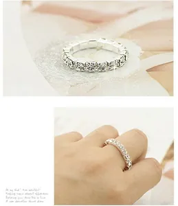 Detail of silver stretch ring with sparkling cubic zirconia in double row arrangement