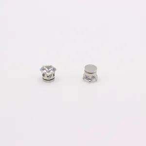 Detail of silver magnetic stud earrings with round cubic zirconia and six-prong crown setting