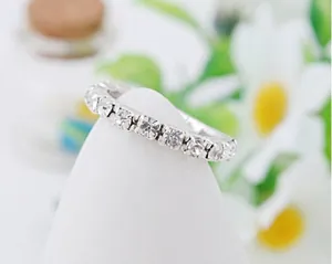 Macro shot of silver elastic eternity ring with single row of sparkling rhinestones