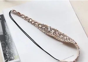 Detail view of handmade headband with faux pearls and crystals on an elastic band