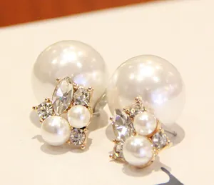 Detailed close-up of double-sided pearl earrings with elegant sparkling rhinestones
