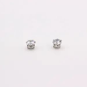 Close-up of clear round cubic zirconia magnetic studs with silver crown setting