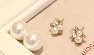 Detailed close-up of double-sided cluster pearl earrings with brilliant rhinestones