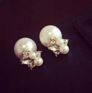 Elegant double-sided pearl stud earrings with sparkling crystals and golden metal base