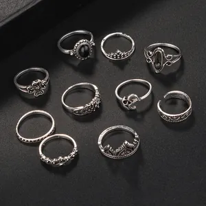 Set of 10 vintage silver alloy rings featuring crown, heart, and black gemstone designs