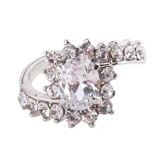 Detailed view of an oval rhinestone ring with silver plating and sparkling micro-pave setting