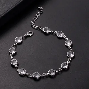 Close-up of a silver lobster clasp and adjustable extender chain on a crystal anklet