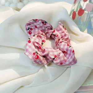 Cute pink and white plaid scrunchie with red cherry print and delicate lace trim