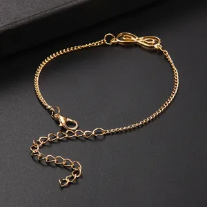 Elegant gold infinity symbol chain bracelet with adjustable clasp on black leather